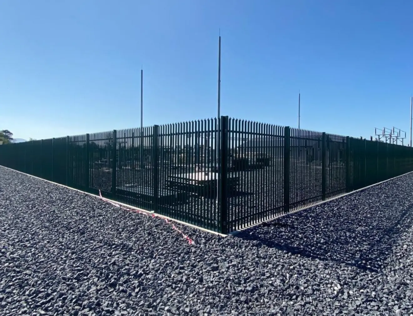 Steel security fencing around a commercial compound